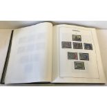 A green The Favorite Philatelic Stamp Album. Containing Great Britain stamps from 1971- 2000.