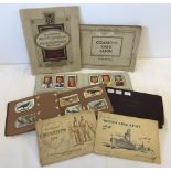 A collection of 7 vintage cigarette card albums.