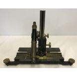 A brass and black painted early 20th century travelling microscope.