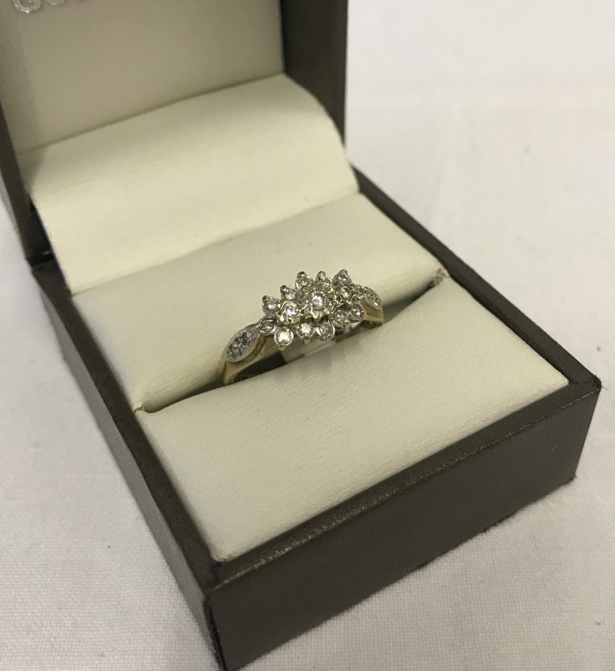 A hallmarked 9ct yellow gold and 1/4 carat diamond ring.