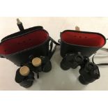 2 cased pairs of binoculars.