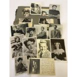 A small album containing a number of original and facsimile signed photographs of film stars.