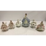 A collection of 1 large and 5 small Dresden lace figurines.