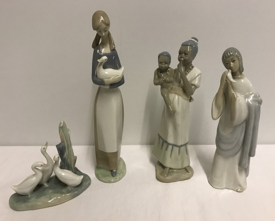 A group of 4 Spanish style porcelain figurines to include Nao.