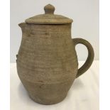 A Bernard Leach, St Ives studio pottery lidded jug with green glaze interior.