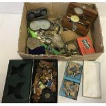 A box of mixed items to include boxed Wade Aqua-Dishes, ladies watches and miniature wooden animals.