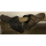 2 vintage Leather horse saddles without stirrups.