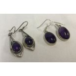 2 pairs of 925 silver drop earrings set with oval amethyst cabochons.