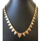 A contemporary gold necklace.