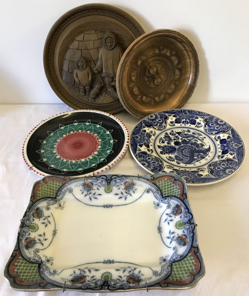 A collection of plates, plaques and chargers.