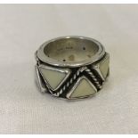 A heavy hallmarked silver ring with triangle design.