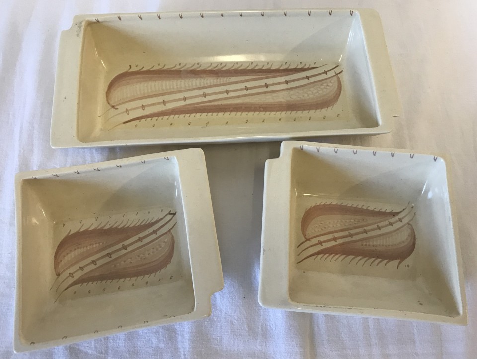 A set of 3 hand painted hors d'oeuvres dishes by Susie Cooper.