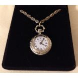 A ladies Tissot miniature pocket watch style pendant watch on a heavy hallmarked silver chain.