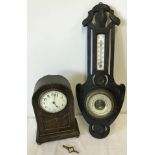 A vintage barometer and mantle clock