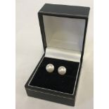 A pair of large real pearl earrings on 14ct posts.