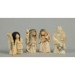 A collection of three Meiji period carved ivory nodding netsukes together with one standing