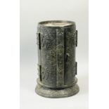 A late 17c Japanese iron Zushi of cylindrical form with two hinged doors, circular base cloud cast