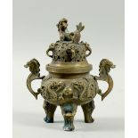 A 19c Chinese bronze incense burner, dragon cast with two carrying handles under a pierced dome