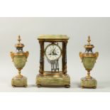 A late 19c French garniture de cheminee comprising a clock and two urns. The clock is in a four