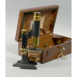 A late 19c students microscope by Thompson and Capper of Liverpool with oxidised base and stem and