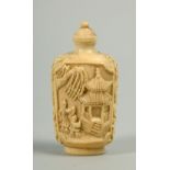 A Japanese Meiji period snuff bottle carved with figures close to a pagoda and under a tree, base