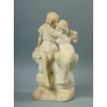 A 19c alabaster sculputre of a Romanesque male and female embracing and seated on a rocky base, a/