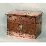 A late Victorian/Edwardian copper fireside fuel bin with two side handles, roundel decorated and