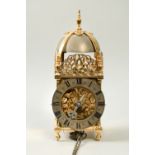 A 20c copy of a late 17c lantern clock by William Gray of London. The thirty hour movement has a