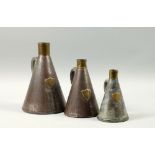 Three Victorian conical steel and brass measures, half galleon, one quart and a pint, the brass