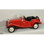 A Touchwood model MG Sports pedal car, red painted with front lights and spare wheel, single