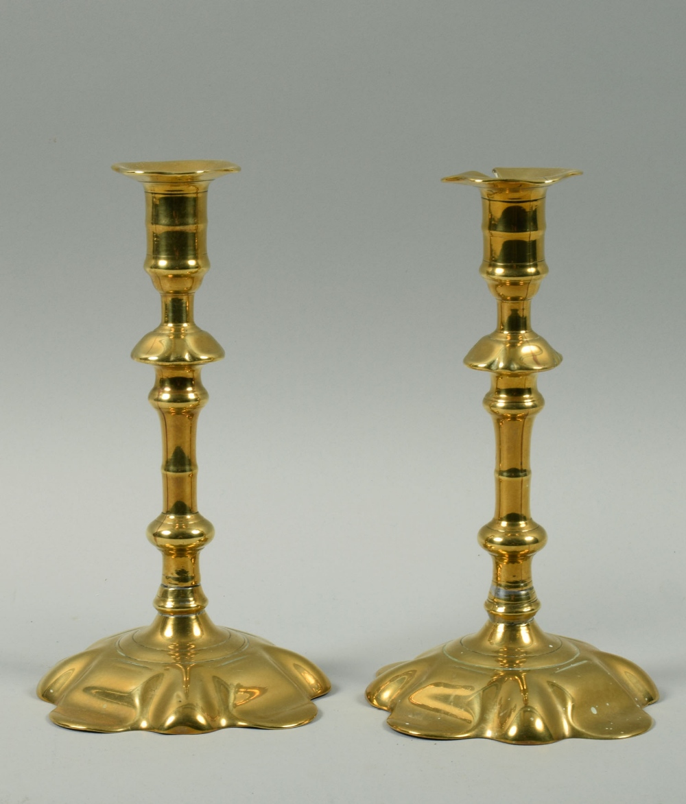 A pair of 18c petal based candlesticks with double knop stems, 8h.