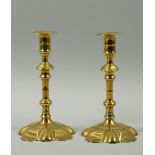 A pair of 18c petal based candlesticks with double knop stems, 8h.