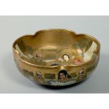 A Meiji period Satsuma bowl of scalloped form, many face decorated, seal mark to base, with an