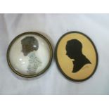 A circular silhouette miniature paperwei