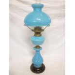 A blue opaque glass oil lamp with balust