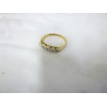 An old 18ct gold engagement ring with pl