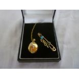 A 9ct gold bar brooch set turquoise and