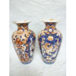 A pair of Japanese Imari pottery tapered