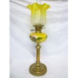 An old brass oil lamp with fluted column