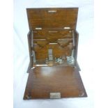 An Edwardian oak stationery cabinet with