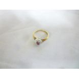 A 9ct gold dress ring set a ruby flanked