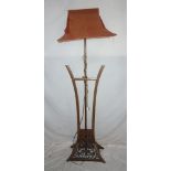 A Chinese rosewood standard lamp with ca