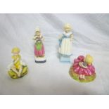 Four Royal Worcester china figures inclu