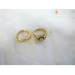 A 9ct gold dress ring set garnets and a