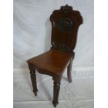 A 19th century carved mahogany hall chai