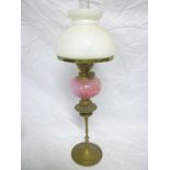 An ornate small Edwardian brass oil lamp