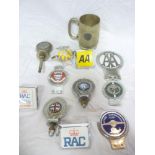 A selection of various vehicle badges an