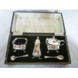 A silver three-piece cruet set comprisin