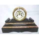 A Victorian mantel clock with part visib