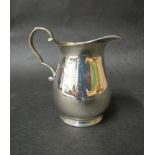 A William Hutton & Sons Ltd silver cream jug on circular base, Birmingham 1931,